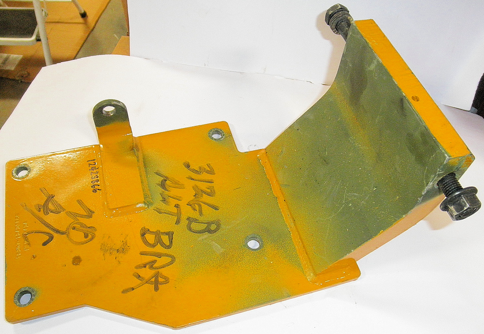 2590-01-559-0415 12423866 FMTV Bracket Assembly; Alternator ***READ*** This was removed from a reman engine. Has Caterpillar Yellow and Forest Green paint. R5B4